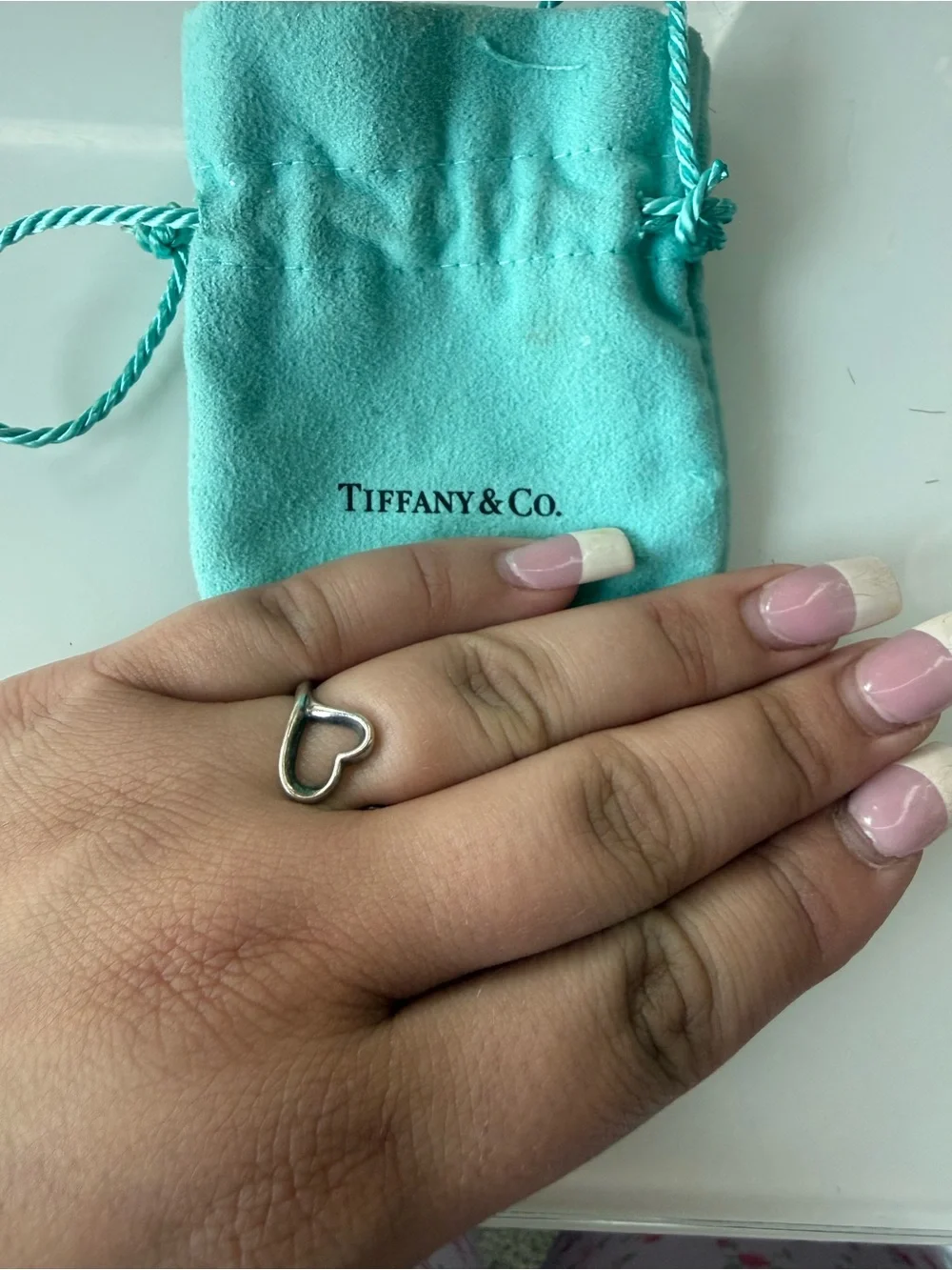 Tiffany heart charm on pouch